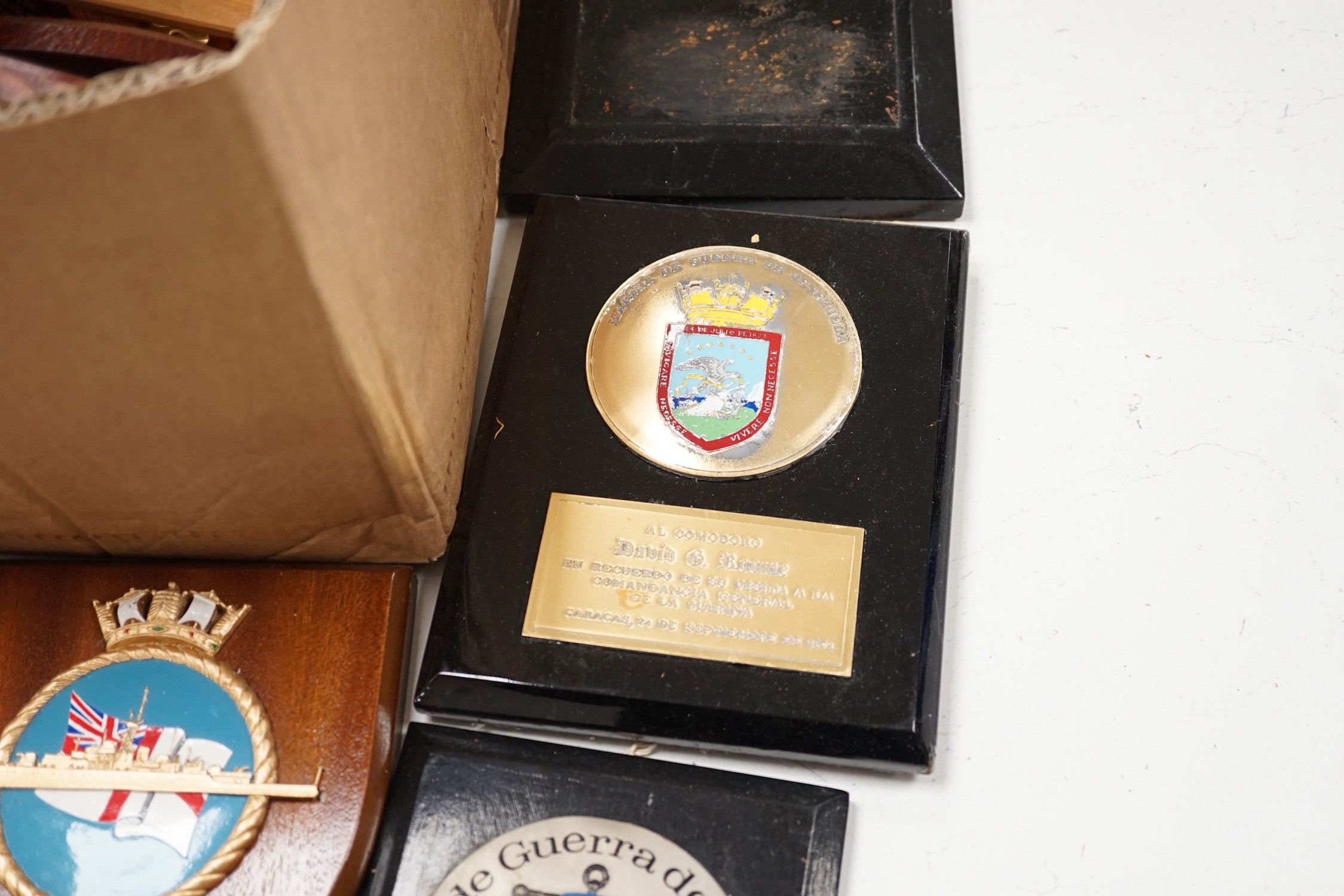 A collection of approximately twenty five plaster and other naval / military and Royal wall hanging plaques